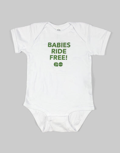 White baby onesie with green text that states 'BABIES RIDE FREE!' and the GO logo below