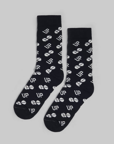 A pair of black socks patterned with white UP and GO logos 