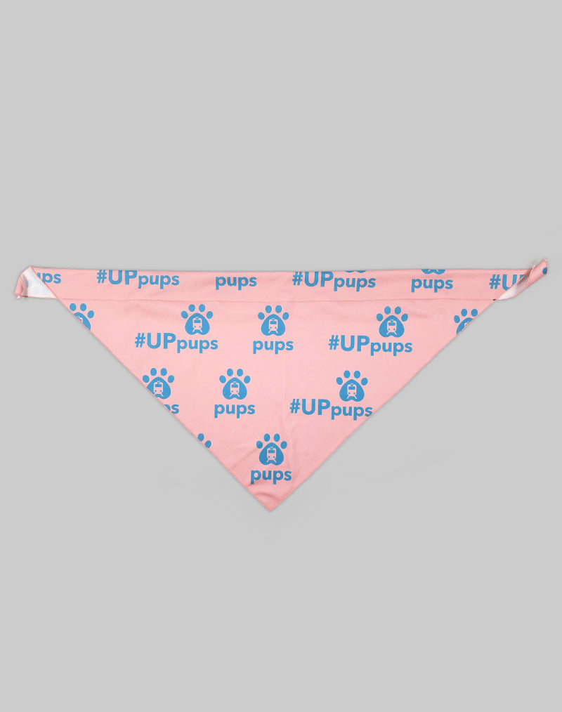 A pink bandana with the UP Pups Logo across in blue, a pawprint with a train on it and pups text below the paw